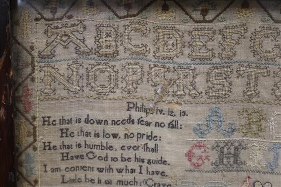 An early 19th century needlework sampler with alphabet, houses, lion, flowers and other motifs, dated 1805, 41 x 31.5cm